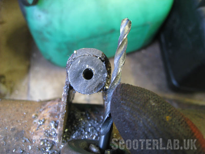 Drill the pin to almost the full depth using a small pilot drill. It is vital that you drill the hole straight through the centre of the pin or your brake pedal will sit at an angle.