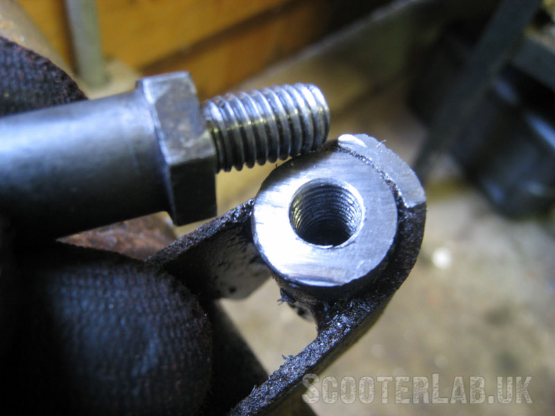 Apply medium strength Loctite to the threads of the pin and wind it firmly into place.