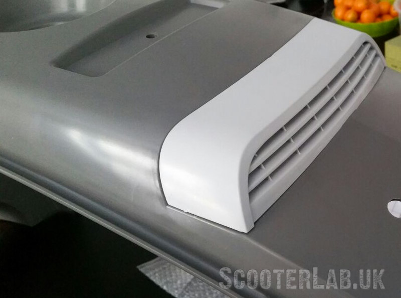 New grille in seat arch section
