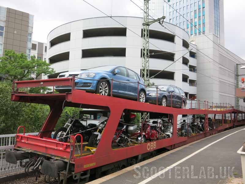 The Motorail train arrives in Dusseldorf loaded with cars, motorcycles and scooters.