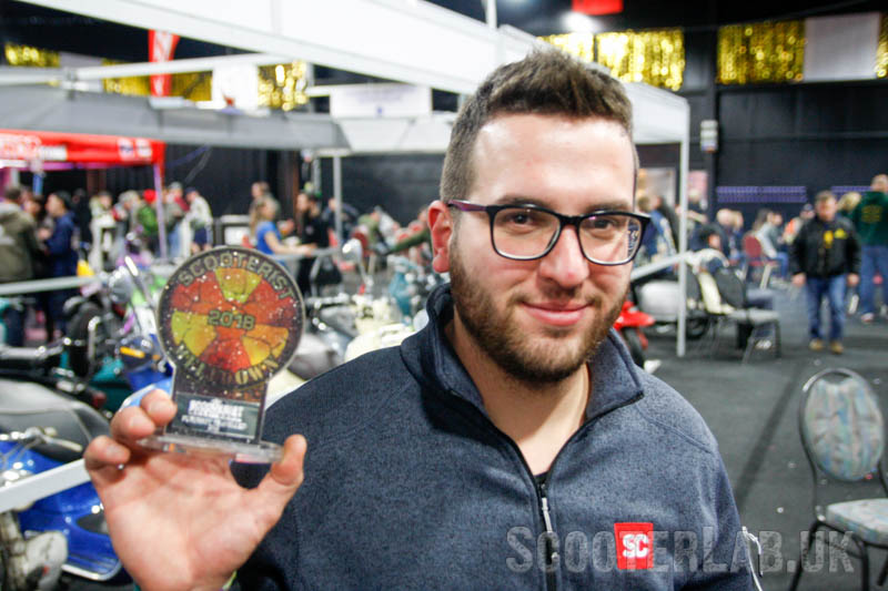Micky with his well-deserved furthest travelled trophy...