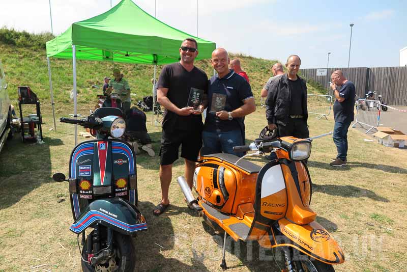 Phil Hallam (left) and Eric Cope with their machines and trophies