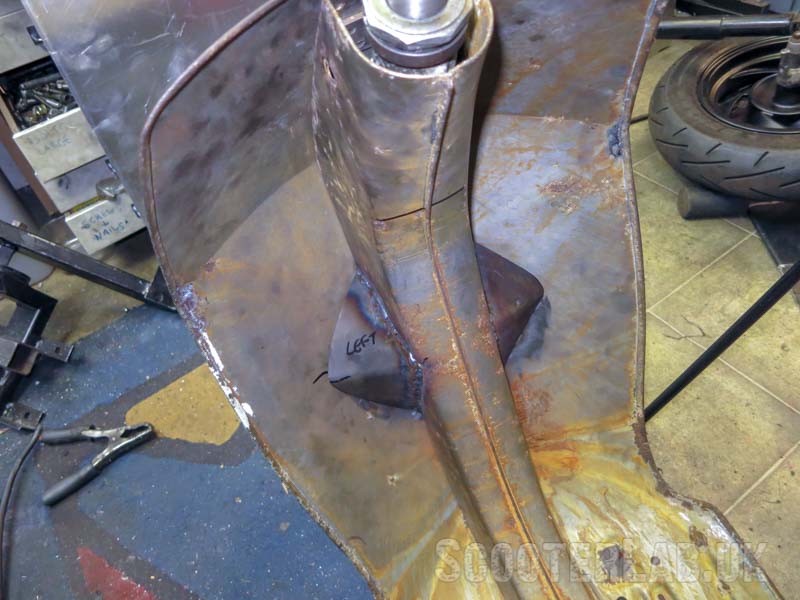 Legshield cut-outs are hidden by covers welded to the centre beam