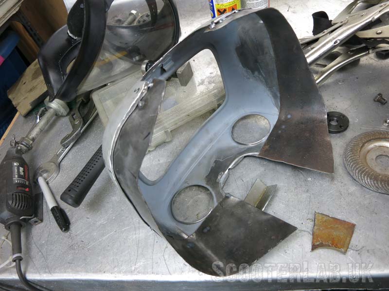 Toolbox is extended with strips of steel that are laboriously welded on.