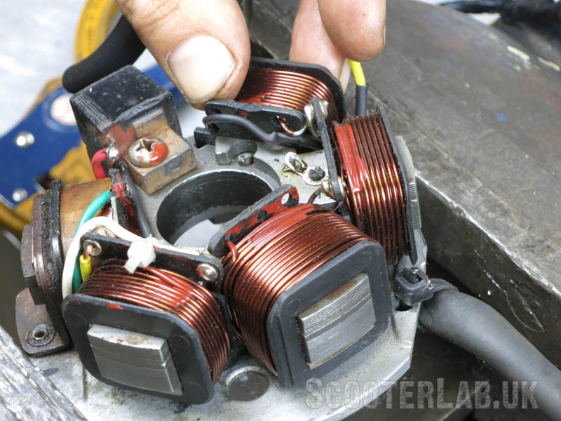 Feed the new yellow wire through to meet with the others exiting the stator plate