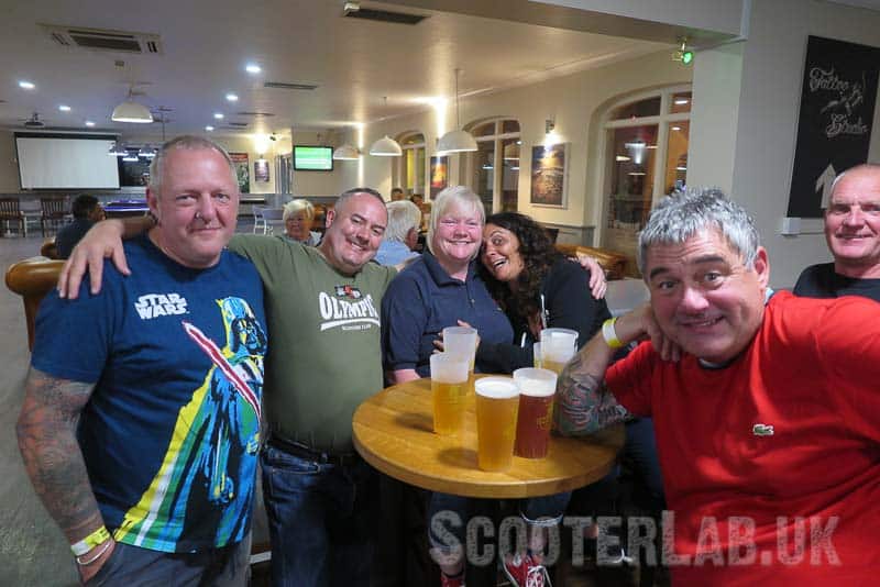 Scooterists saving the planet by drinking beer