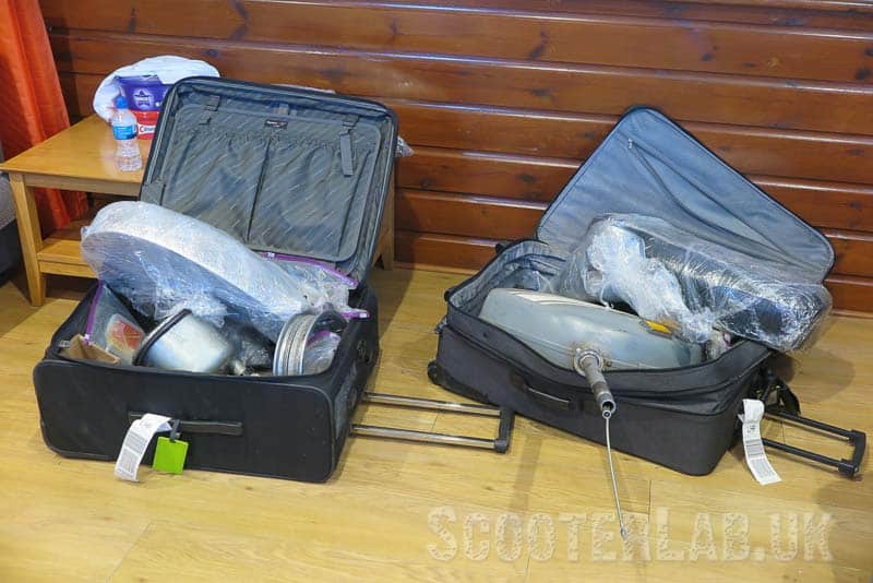 Two of the five suitcases needed to ship a Vespa in from America - ingenious!