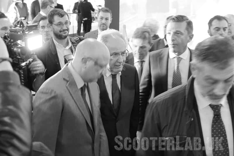 A media circus and heavy security surrounds Piaggio CEO Roberto Colaninno (centre wearing spectacles) wherever he goes in Italy.