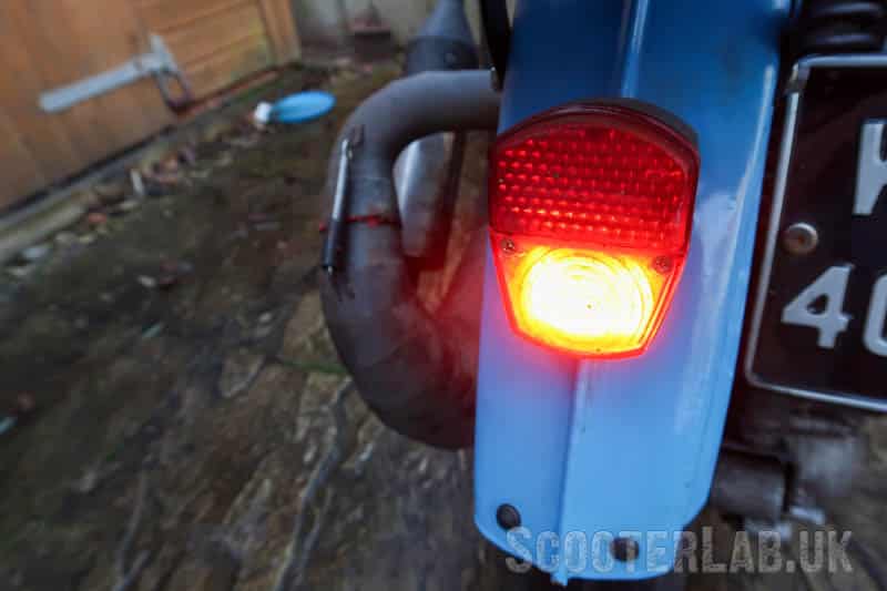 A bright rear light, even off a normal 12V AC Vespa electrical system