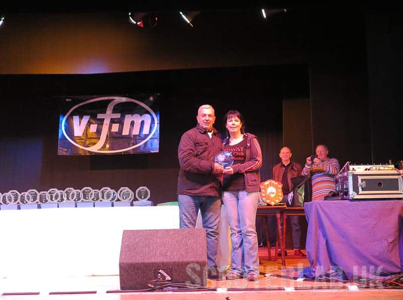 2019 female winner, Helen Rumsey gets her trophy from Rick