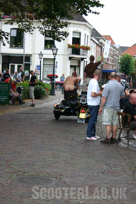 Nothing says 'goodbye to Holiday in Holland' better than a mohican sporting scooterboy moonying from the sidecar of a commandeered sidecar outfit...