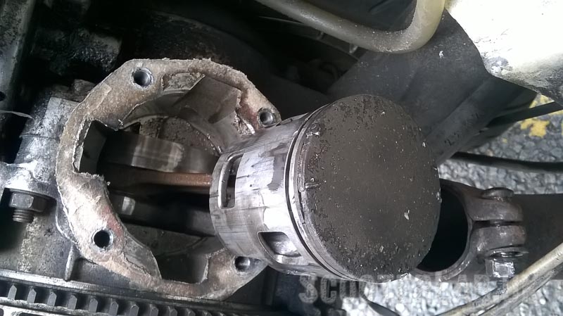 Nice chunk out of the top of the piston that seems mostly to be residing in the bottom of the crankcases