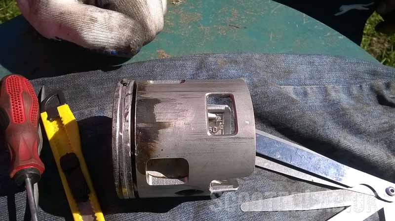 Piston removed as the rings prove a little harder to free off. The bottom ring came free but in the end the top ring had been scored through and snapped...