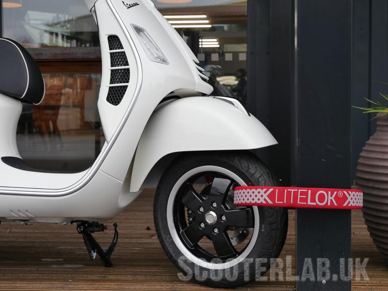 Fits through the wheels of a Vespa GTS