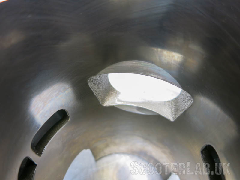 Chamferings above and below the port should aid ring life.