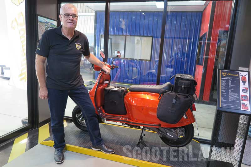 Frank at the factory showing off some aftermarket luggage on the lovely orange TT
