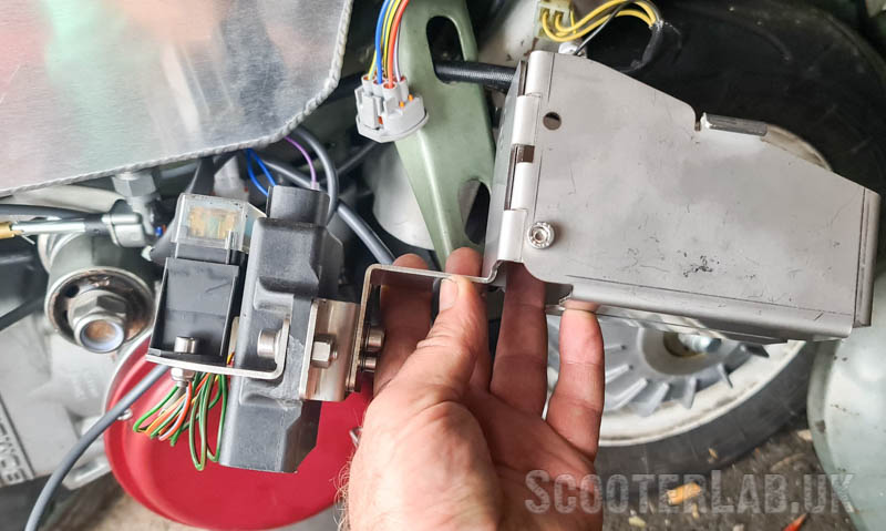 This pressed steel electrics bracket bolts to the running board support leg.