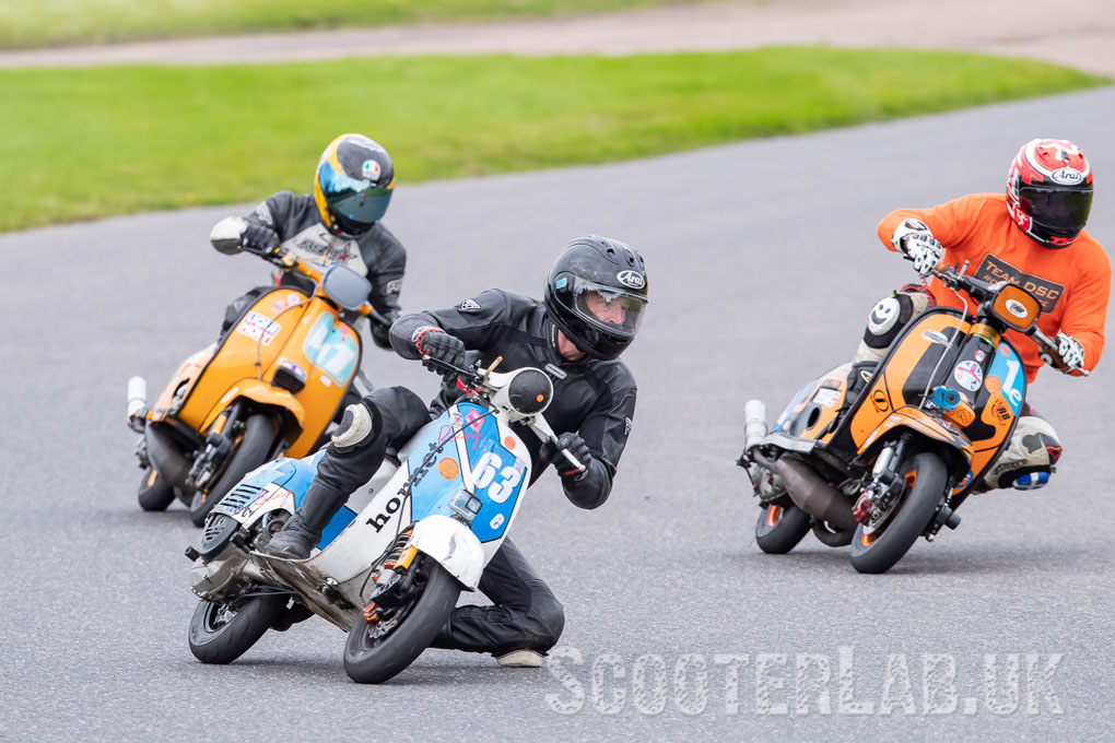 Dave Bristow hornet racing knee down on his Vespa at Lydden