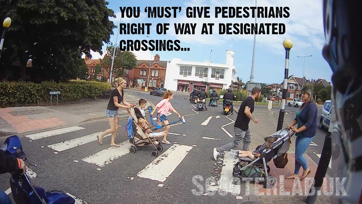 pedestrians crossing in front of scooters